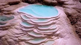 Drone footage showcases magnificent travertine terraces in southwestern China