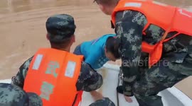 Chinese police rescue people trapped in flooded houses after strong rainstorm