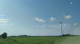 Wind Mills Blowing in a Field