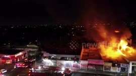 Flames engulf shop during riots in Fairfax district, Los Angeles