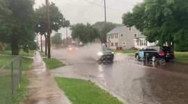 Flash flooding in Sioux Falls, South Dakota as heavy rain floods street amid intense storms