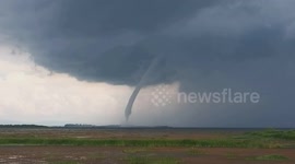 Huge tornado rips through field in northern Thailand