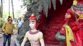 Demons wear Covid-19 face masks at Buddhist 'hell garden' in Thailand