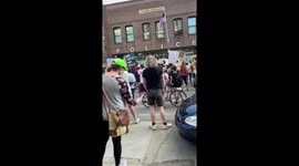 Black Lives Matter activists chant in front of Minneapolis police station