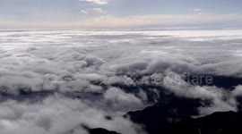 Stunning timelapse showcases sea of clouds flowing through mountains in northern China
