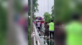 'The bridge is going to collapse': Security guard shouts at a group of women dancing on glass bridge in China