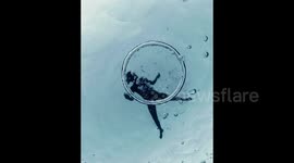 Woman dives through mesmerising bubble ring off Menorca coast