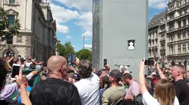 Far-right protesters surround boarded-up statue of Churchill to sing