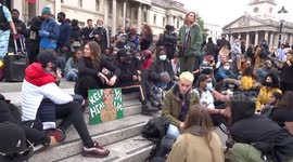 Young and cheerful BLM protestors sing and dance in Trafalgar Square