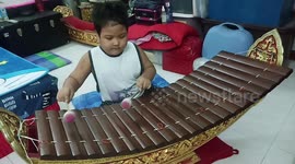 Talented five-year-old boy plays traditional Thai xylophone