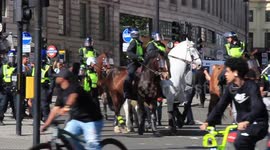 Police escort injured man who was attacked by 'Black Lives Matter' protesters in London