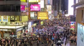 Hong Kong police fire pepper balls and arrest more than 50 as protesters mark a year since mass march