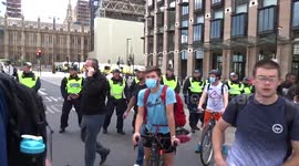 Police block entry to Westminster Bridge with mixed crowds of protesters on the Victoria Embankment