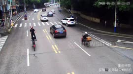 Police penalise Chinese biker as he stands on motorcycle while driving along busy road