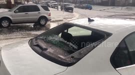 Tennis-ball sized hail storm smashes car window in Calgary, Canada