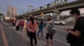 Long queue on riding bus with almost minimal social distancing observed