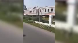 Driver scrambled from stranded car moments before train crash in Indonesia