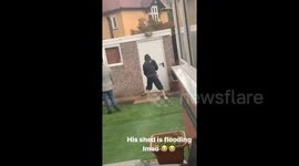 UK man hilariously tries to broom away water from shed as storm floods northern England