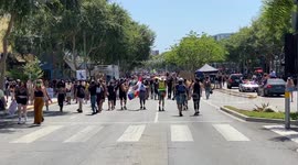 Thousands of All Black Lives Matters West Hollywood Parade walking along Santa Monica Boulevard having fun with protest signs