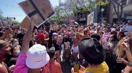 Thousands of All Black Lives Matters West Hollywood Parade dancing along Santa Monica Boulevard having fun with protest signs