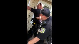Tense confrontation boils over when Indiana cops arrest black man after housing dispute