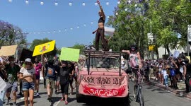 Black Trans Lives Matter Party truck with DJ driving with thousands of All Black Lives Matter protestors partying down Santa Monica Boulevard at the All Black Lives Matter Parade