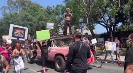Black Tran Lives Matter Party truck with DJ driving with thousands of All Black Lives Matter protestors partying down Santa Monica Boulevard at the All Black Lives Matter Parade