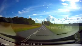 Near misses : A biker grazes cars when he overtake