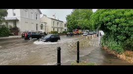 Flash floods cause traffic jams in Cheltenham, South West England
