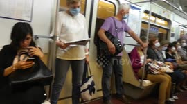 Commuters seen without masks breaking social distancing guidelines on Russian tube