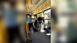 Chinese woman climbs into bus through window after being refused entry without scanning health QR code
