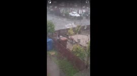 Heavy rain causes water to burst through manhole in Trowell, UK