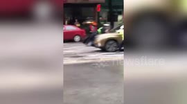 Motorist drives off with police officer on bonnet to avoid inspection in China