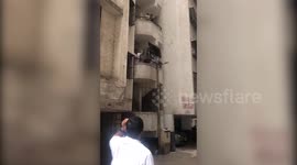 Infuriated with China amid tension at border, Indians fling Chinese TV set out of building in western India