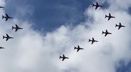 Red Arrows and Patrouille de France fly over river Thames at Weybridge, Surrey