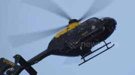 Close up of the Sussex Police helicopter hovering over Crawley