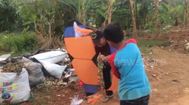 Father and son take up kite-flying as season starts in Indonesia