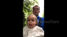 Adorable UK baby tries to say 'cucumber' while walking with dad