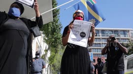 Activist protest and hand demands to police for better handling of gender based violence crimes