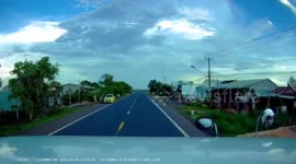 Truck driver slams on brakes when careless cyclist rides into road