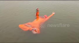 Bizarre 'water yoga' performed on waters of Ganges river