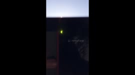 Woman witnesses the eclipse with some welder's glass