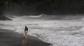 SURFING AND PLAYING WASTE AT PADANG BEACH, WEST SUMATERA