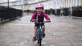 Meet the two year old cyclist who can ride without stabilisers and recently biked 45 miles - one for every minute her sister lived