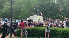 Police versus protesters in Lafayette Square as protesters try to tear down Andrew Jackson statue