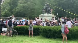 Police try to break protesters line at Lafayette Square as protesters attempt to tear down statue