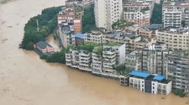 Record-breaking flood submerges cars and buildings in southern China