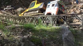 Moment truck plummets into gorge after bridge buckles under its weight in northern India