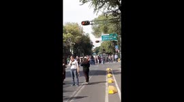 Residents of Mexico City evacuate buildings after powerful earthquake hits southern Mexico