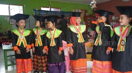 Graduation Ceremony at Kindergarten School by Wearing Student Graduation Clothes